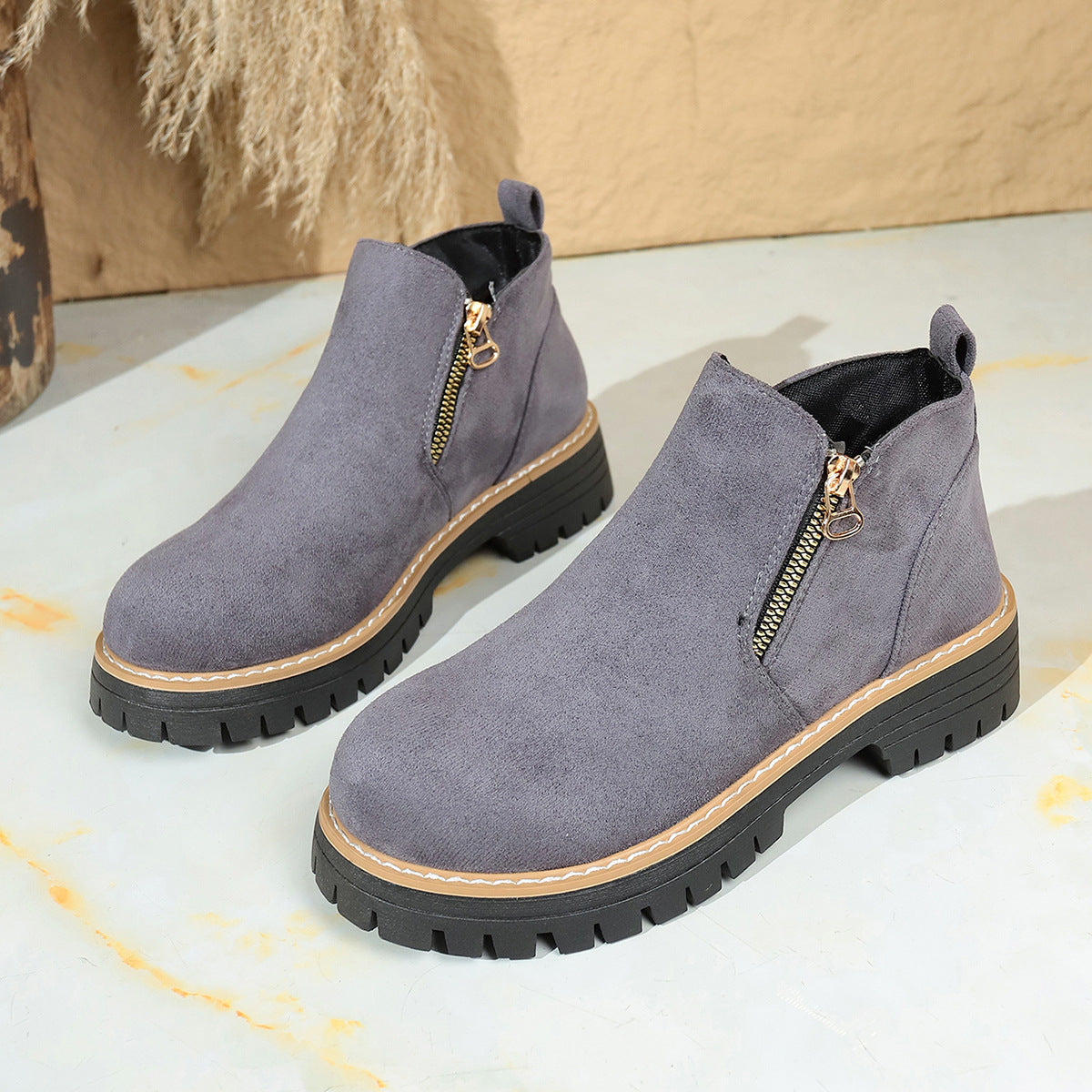 Bottines à fermeture zippée et semelle crantée élégante